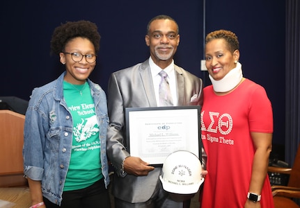 Code 105.7 Michael Williams and family celebrate his completion of the Executive Development Program.