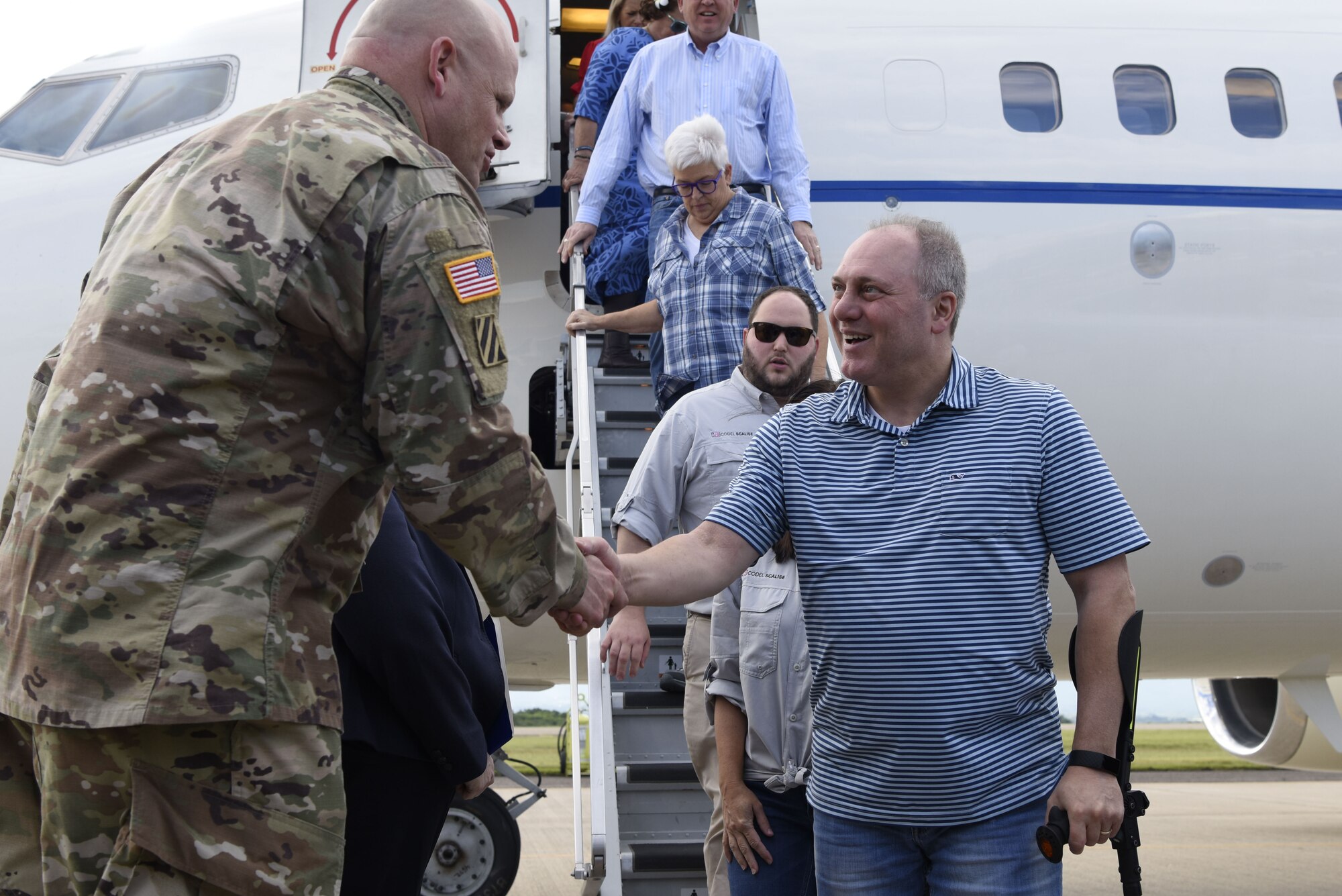 Mr. Steven Scalise, Minority Whip US House of Representatives, is greeted by US Army Col. Steven Barry as he deboards his plane