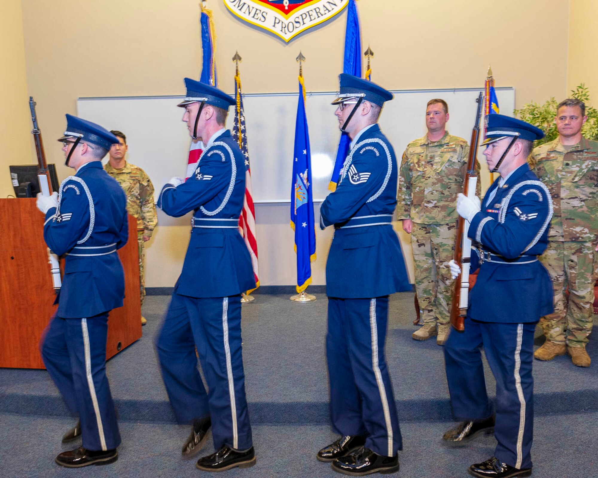 The honor guard presents the colors during an assumption of command ceremony for the 327th Airlift Squadron on Nov. 2, 2019, at Little Rock Air Force Base, Ark. The ceremony is a military tradition demonstrating the handover of responsibility and command to the newly appointed leadership. (U.S. Air Force Reserve photo by Maj. Ashley Walker)