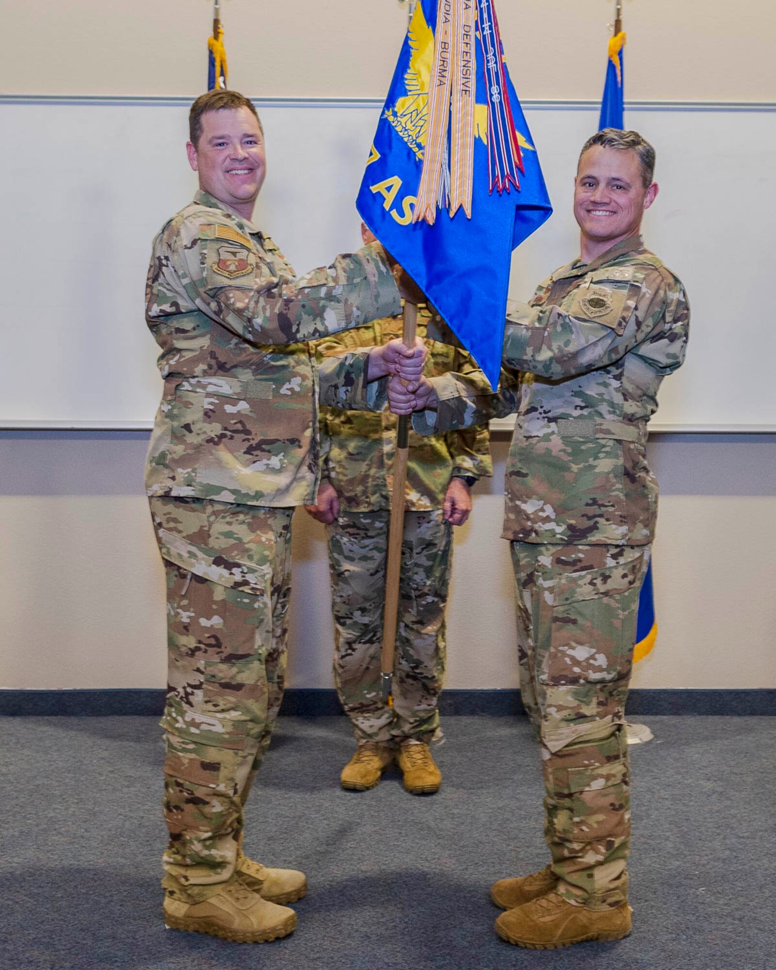 913th Airlift Group deputy commander Col. Daniel Collister (left) passes the guidon to 327th Airlift Squadron commander Lt. Col. Jeremy Wagner during the assumption of command ceremony at Little Rock Air Force Base, Ark. Nov. 3, 2019. Previous to his command, Lt. Col. Wagner was the chief pilot for the squadron who has more than 2,800 hours in the C-130. (U.S. Air Force Reserve photo by Maj. Ashley Walker)