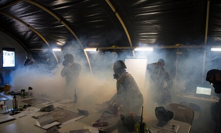 Airmen evacuate the Emergency Operations Center after a simulated chemical attack during Palmetto Challenge at McEntire Joint National Guard Base, S.C., Nov. 3, 2019. The goal of the exercise was to develop and maintain full-spectrum readiness and ensure JB Charleston’s Airmen were ready for rapid mobilization and able to support Air Mobility Command and DOD priorities. Both active-duty and reserve Airmen from the 628th Air Base Wing, 437th Airlift Wing and 315th Airlift Wing came together to train in operating in an austere environment. More than 140 Airmen took part in the global mobilization readiness exercise at McEntire Joint National Guard Base, and Pope Army Airfield, S.C.