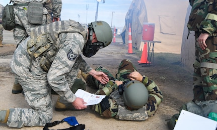 Tech. Sgt. Richard Moss, 628th Fighter Wing Judge Advocate legal specialist performs simulated first-aid care in response to a chemical attack exercise during Palmetto Challenge at McEntire Joint National Guard Base, S.C., Nov. 3, 2019. The goal of the exercise was to develop and maintain full-spectrum readiness and ensure JB Charleston’s Airmen were ready for rapid mobilization and able to support Air Mobility Command and DOD priorities. Both active-duty and reserve Airmen from the 628th Air Base Wing, 437th Airlift Wing and 315th Airlift Wing came together to train in operating in an austere environment. More than 140 Airmen took part in the global mobilization readiness exercise at McEntire Joint National Guard Base, and Pope Army Airfield, S.C.
