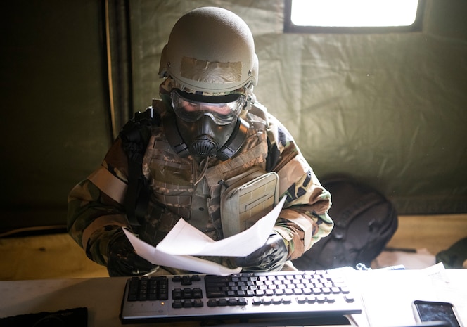 U.S. Air Force Staff Sgt. Jordan Stinson, 628th Comptroller Squadron financial analyst, looks over simulated financial purchases after a chemical attack exercise during Palmetto Challenge at McEntire Joint National Guard Base, S.C., Nov. 3, 2019. The goal of the exercise was to develop and maintain full-spectrum readiness and ensure JB Charleston’s Airmen were ready for rapid mobilization and able to support Air Mobility Command and DOD priorities. Both active-duty and reserve Airmen from the 628th Air Base Wing, 437th Airlift Wing and 315th Airlift Wing came together to train in operating in an austere environment. More than 140 Airmen took part in the global mobilization readiness exercise at McEntire Joint National Guard Base, and Pope Army Airfield, S.C.
