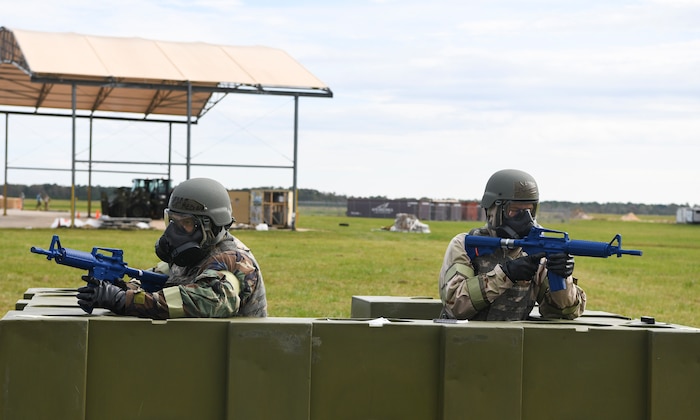 Airmen guard their post at a defensive position during Palmetto Challenge at McEntire Joint National Guard Base, S.C., Nov. 3, 2019. The goal of the exercise was to develop and maintain full-spectrum readiness and ensure JB Charleston’s Airmen were ready for rapid mobilization and able to support Air Mobility Command and DOD priorities. Both active-duty and reserve Airmen from the 628th Air Base Wing, 437th Airlift Wing and 315th Airlift Wing came together to train in operating in an austere environment. More than 140 Airmen took part in the global mobilization readiness exercise at McEntire Joint National Guard Base, and Pope Army Airfield, S.C.