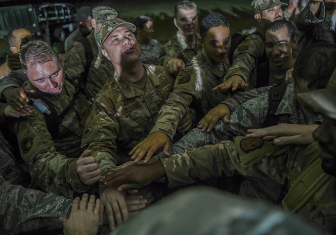 U.S. Air Force Col. Bobby DeGregorio, 315th Airlift Wing Mission Support Group and Palmetto Challenge exercise commander joins in a celebratory moment with his Airmen after the redeployment orders are announced at McEntire Joint National Guard Base, S.C., Nov. 4, 2019. The goal of the exercise was to develop and maintain full-spectrum readiness and ensure JB Charleston’s Airmen were ready for rapid mobilization and able to support Air Mobility Command and DOD priorities. Both active-duty and reserve Airmen from the 628th Air Base Wing, 437th Airlift Wing and 315th Airlift Wing came together to train in operating in an austere environment. More than 140 Airmen took part in the global mobilization readiness exercise at McEntire Joint National Guard Base, and Pope Army Airfield, S.C.