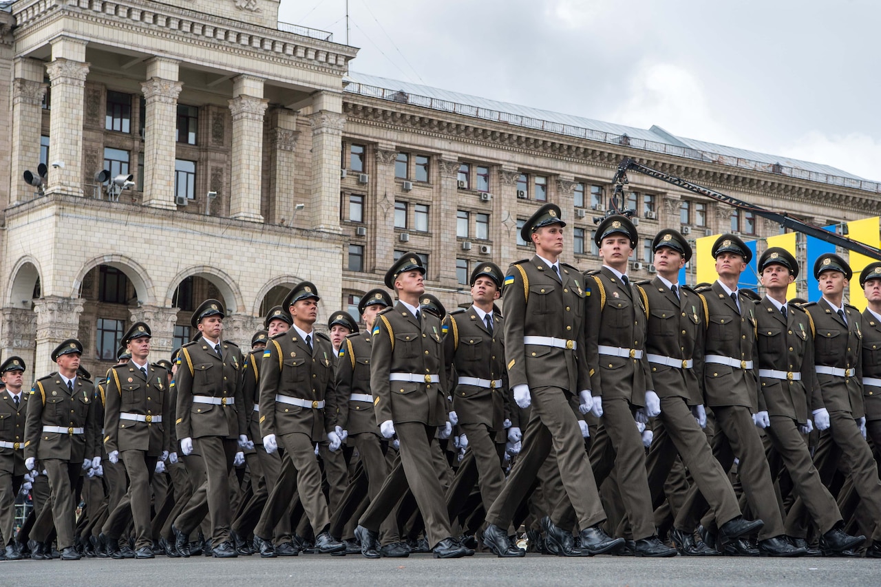 Soldiers march in formation.