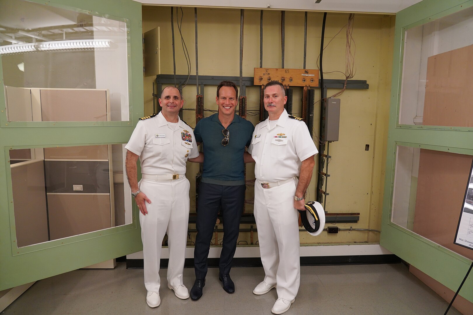 Hollywood actor Patrick Wilson tours Station Hypo with U.S. PACFLT Director of Intelligence and Information Operations Capt. Tony Butera and PHNSY&IMF Executive Officer Cmdr. Scott Shea. Wilson plays Edwin Layton, an intelligence officer who worked at Pearl Harbor –including at Station Hypo– during World War II, in the upcoming movie Midway.
