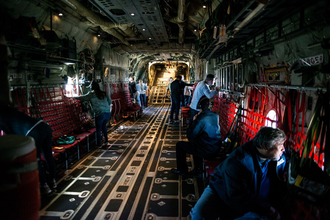 Members of the bosslift and spouse orientation flight look out the port windows while C-130J Hercules aircraft conducts a low-level flight across central Arkansas on Nov. 3, 2019. The employers were participating in an Employer Support of the Guard and Reserve “Bosslift,” which enhances awareness and understanding between Reserve military members and the civilian employers. Activities began with a briefing by Col. Daniel Collister, 913th Airlift Group deputy commander, who expressed his gratitude to the employers. Following the remarks, Senator Jane English presented certificates of appreciation as the ESGR state chairwoman. (U.S. Air Force Reserve photo by Senior Airman Chase Cannon)