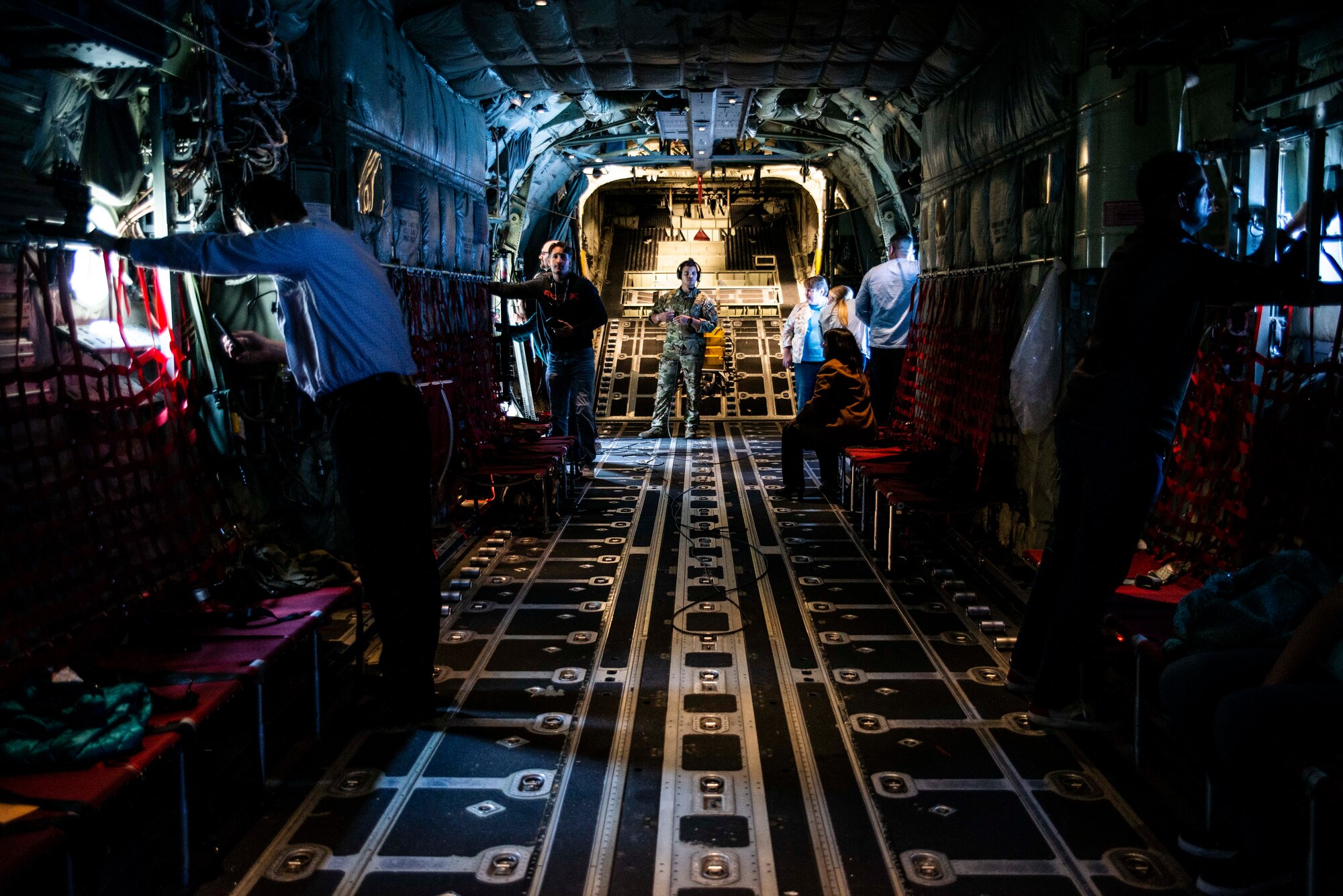 Members of the bosslift and spouse orientation flight look out the port windows while C-130J Hercules aircraft conducts a low-level flight across central Arkansas on Nov. 3, 2019. The employers were participating in an Employer Support of the Guard and Reserve “Bosslift,” which enhances awareness and understanding between Reserve military members and the civilian employers. Activities began with a briefing by Col. Daniel Collister, 913th Airlift Group deputy commander, who expressed his gratitude to the employers. Following the remarks, Senator Jane English presented certificates of appreciation as the ESGR state chairwoman. (U.S. Air Force Reserve photo by Senior Airman Chase Cannon)