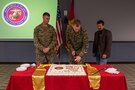As the oldest, youngest and senior-ranked members, Joint Task Force Civil Support Chief of Staff U.S. Marine Corps Col. Timothy Powledge (middle), U.S. Marine Corps SSgt. Jordan Freking (left) and U.S. Marine Corps Maj. (ret) Stan Bacon (right) cut the cake during the 244th Marine Corps birthday celebration. The cake-cutting ceremony signifies an annual renewal of each Marine’s commitment to the Marine Corps, and the Marine Corps’ commitment to our nation. The tradition of the youngest and oldest Marine cutting the cake signifies the passing of knowledge and experience from senior to junior. (Official DoD photo by Mass Communication Specialist 3rd Class Michael Redd/RELEASED)