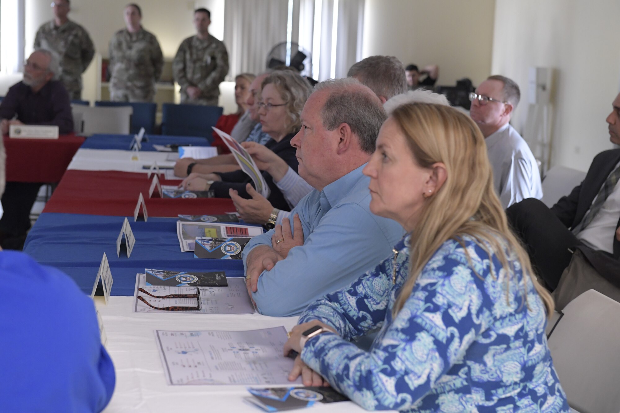 Congressional delegates listen to a brief