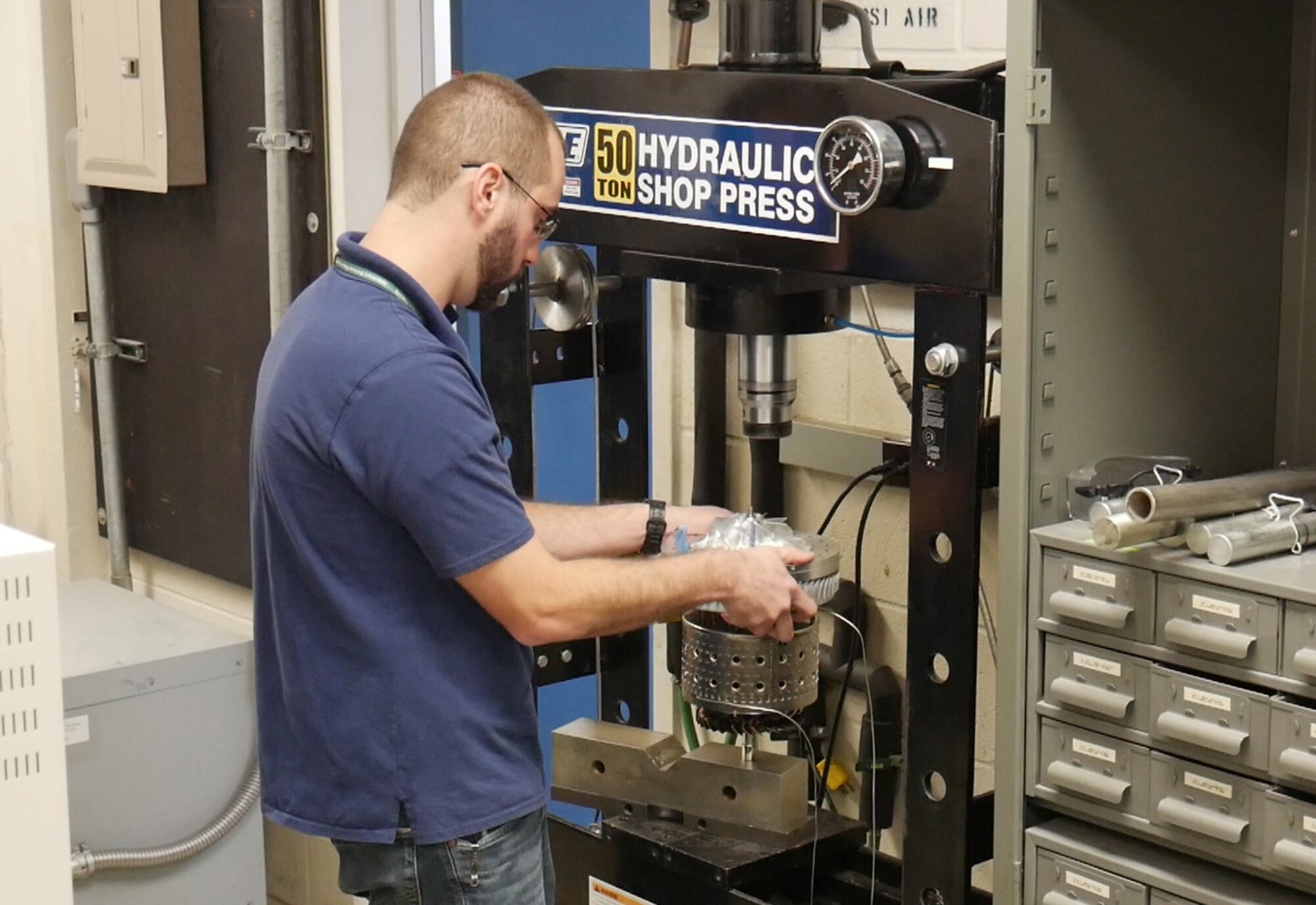 Air Force Research Laboratory engineer Justin Reinhart completes final assembly of the Responsive Open Source Engine turbine in preparation for testing. ROSE is a rapid development effort executed within 13 months and is the first turbine engine designed, assembled, and tested exclusively within AFRL. (U.S. Air Force Photo/Tim Bergeron)