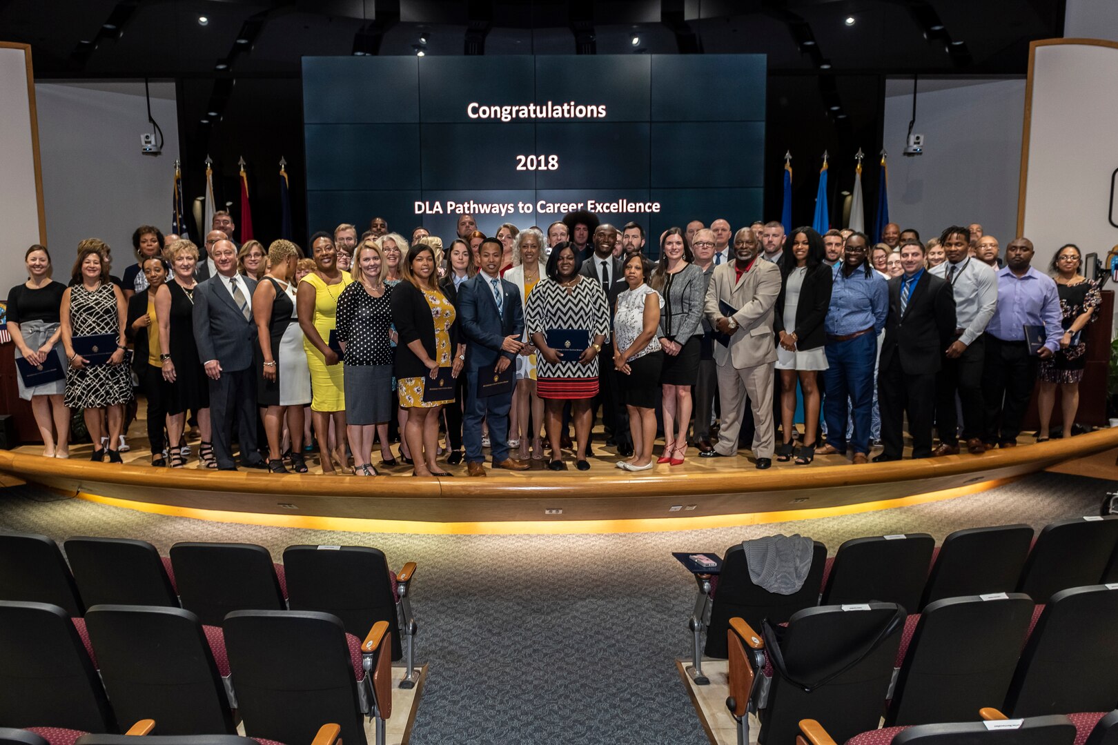 Group photo of a hundred people who graduated.