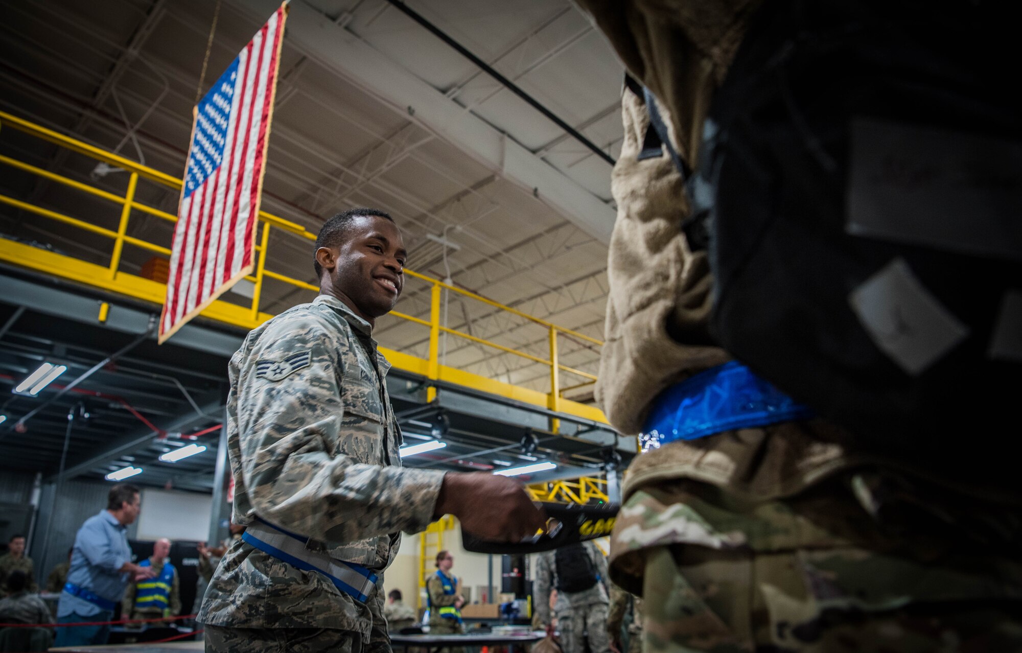 Airman performs security check