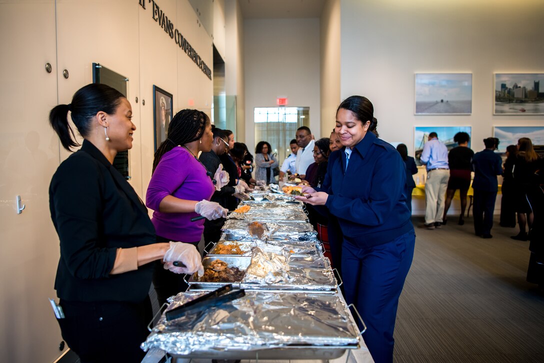 Coast Guard members and civilian employees sample foods from black culture around the world after the black history month celebration at Coast Guard Headquarters in Washington, D.C.,