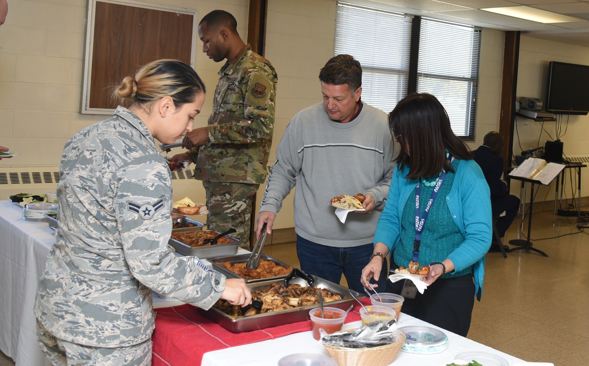 Attendees sample various foods at the first Diversity Heritage Day on Kirtland Air Force Base, N.M., Nov. 6, 2019. The event was created to educate the workforce on ethnic barriers in the workplace. (U.S. Air Force photo by Airman 1st Class Ireland Summers)