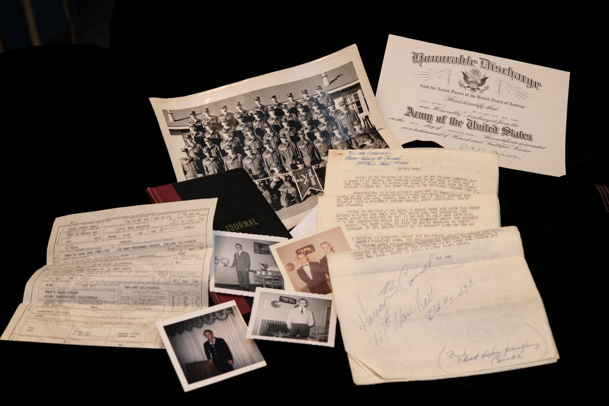 Historical documents and memorabilia belonging to Specialist 5th Class Harvey Couch are displayed