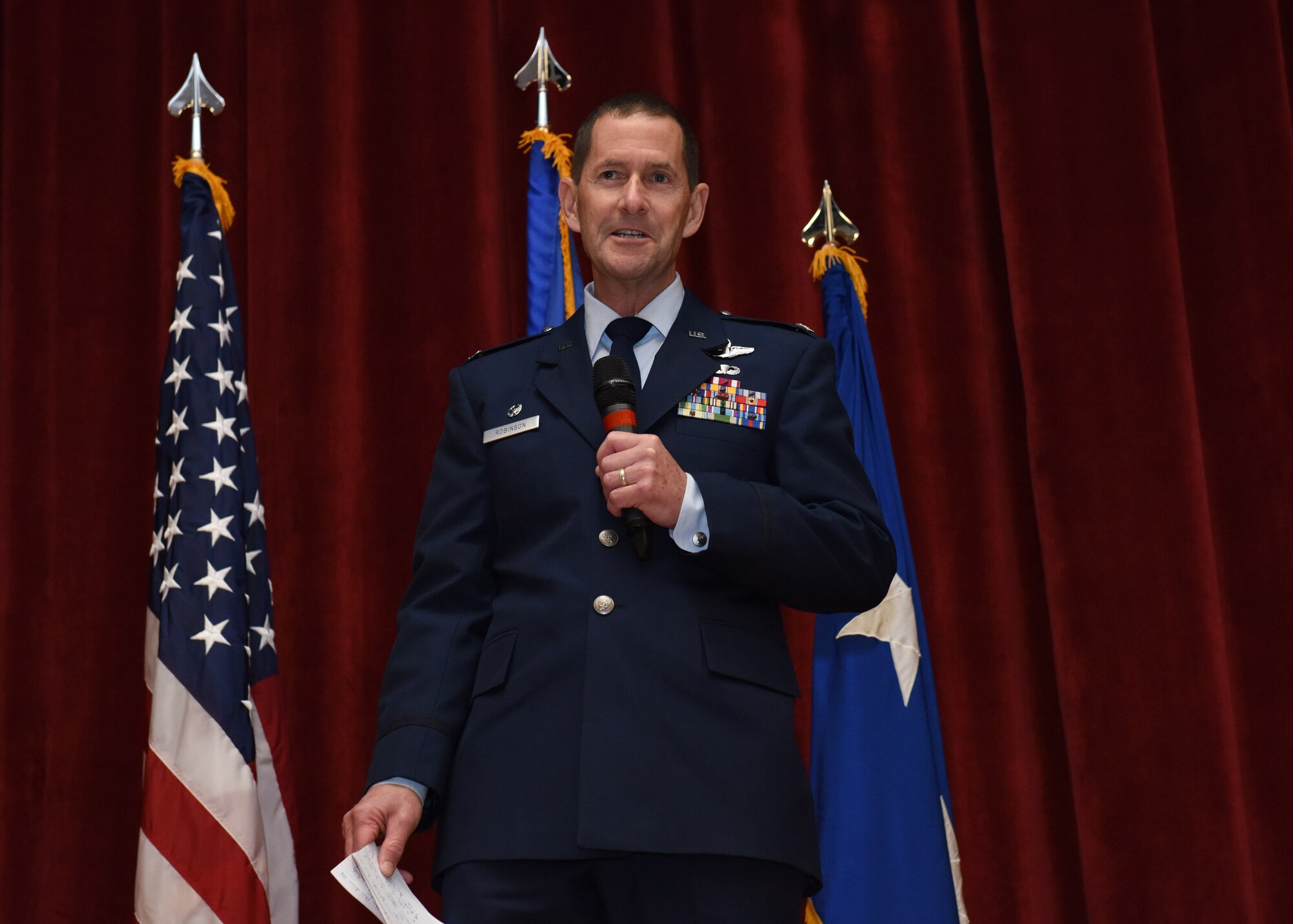 Col. John F. Robinson, 911th Airlift Wing commander, addresses Airmen and guests during his assumption of command ceremony at Moon Area Middle School in Coraopolis, Pennsylvania, Nov. 2, 2019.
