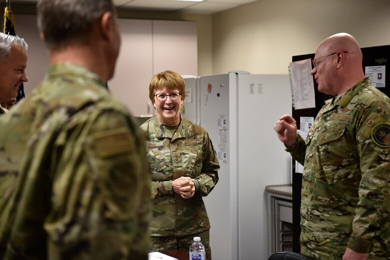Lt. Gen. Dorothy Hogg, U.S. Air Force Surgeon General, visits with 21st Medical Group leadership at Schriever Air Force Base, Colorado, Nov. 1, 2019. The visit started with a mission briefing and was then followed by a tour of the facilities, where Hogg was able to meet Airmen and ask them about their jobs and what they might need to better accomplish the mission. (U.S. Air Force photo by Airman Alexis Christian)
