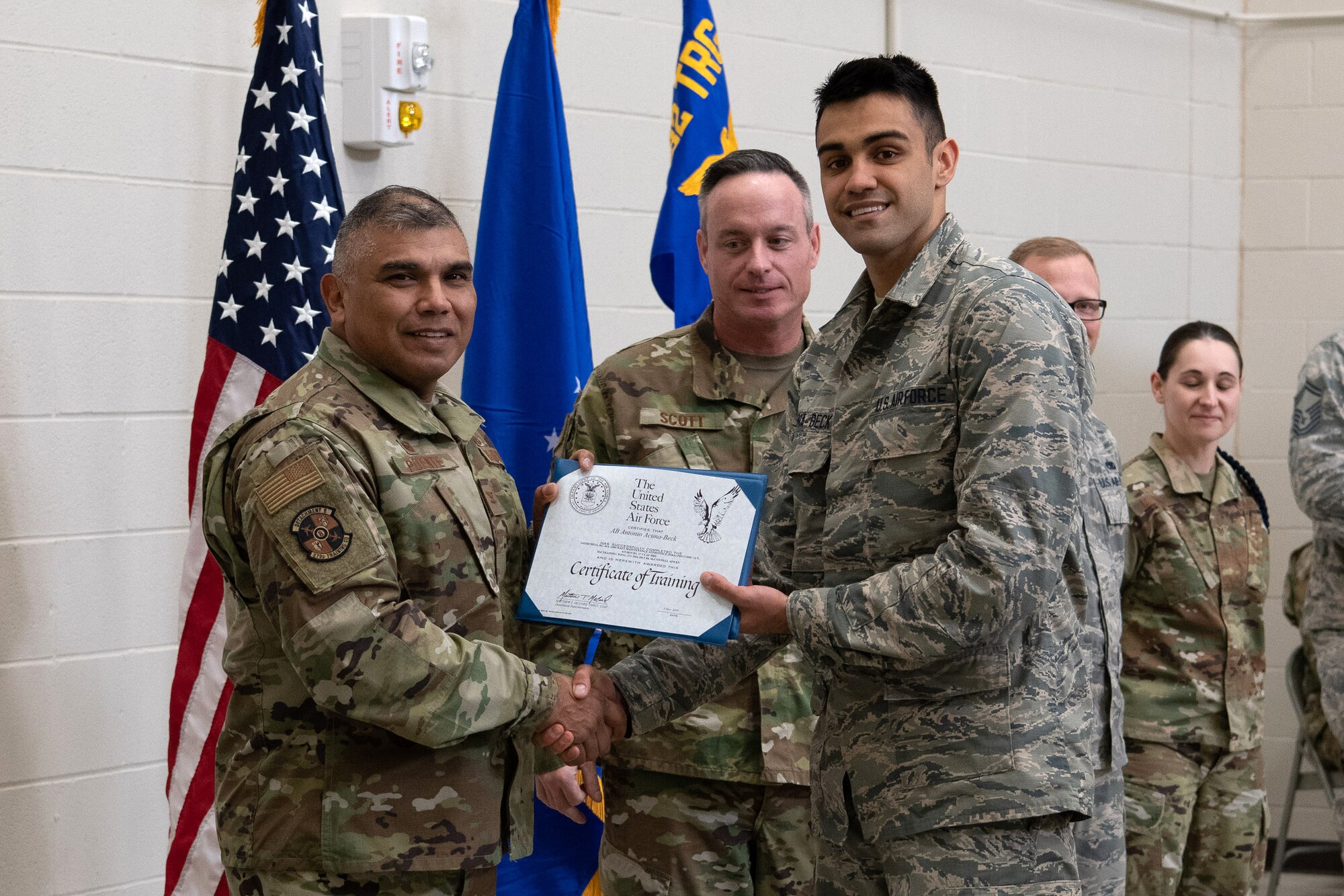 Col. Anthony Puente, 982nd Training Group commander, presents Airman Antonio Acunaback, 22nd Maintenance Squadron crew chief, with a Certificate of Training during the Mission Ready Airmen program graduation Nov. 5, 2019, at McConnell Air Force Base, Kan. Four Airmen graduated from McConnell’s first Mission Ready Airmen program. (U.S. Air Force photo by Staff Sgt. Alexandria Brun)