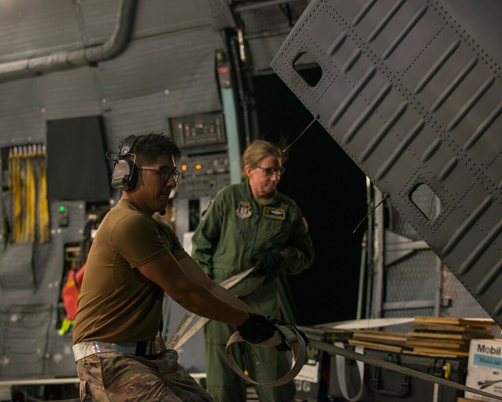 A U.S. Air Force Airman assists in unloading an HH-60 Pave Hawk helicopter assigned to the 305th Rescue Squadron, Davis-Monthan Air Force Base, Ariz., from a C-5 Super Galaxy assigned to the 512th Airlift Wing, Dover Air Force Base, Del., at MacDill Air Force Base, Fla., Nov. 6, 2019.