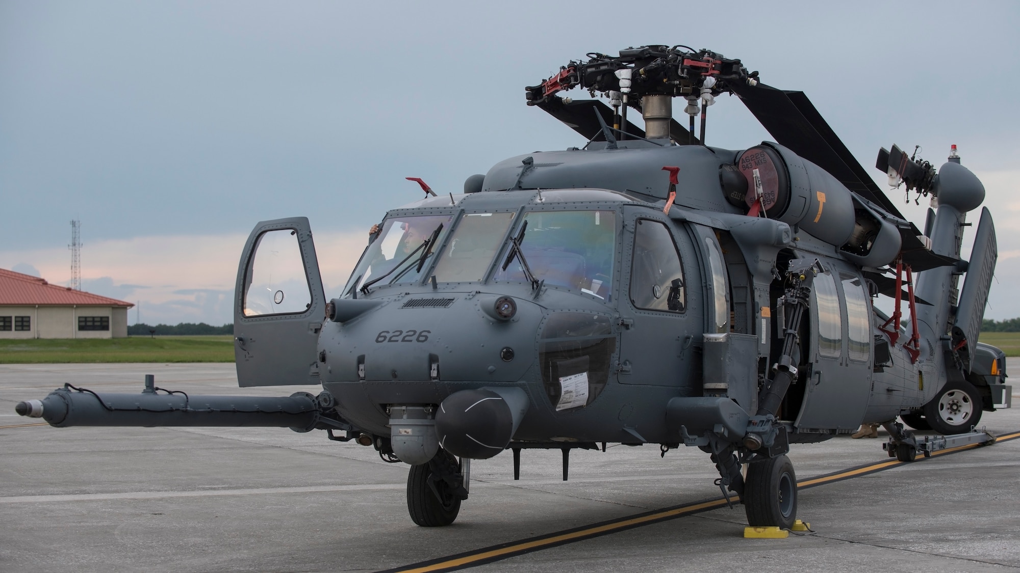 An HH-60 Pave Hawk helicopter assigned to the 305th Rescue Squadron (RQS), Davis-Monthan Air Force Base, Ariz., sits on the flightline at MacDill Air Force Base, Fla., Nov. 5, 2019.