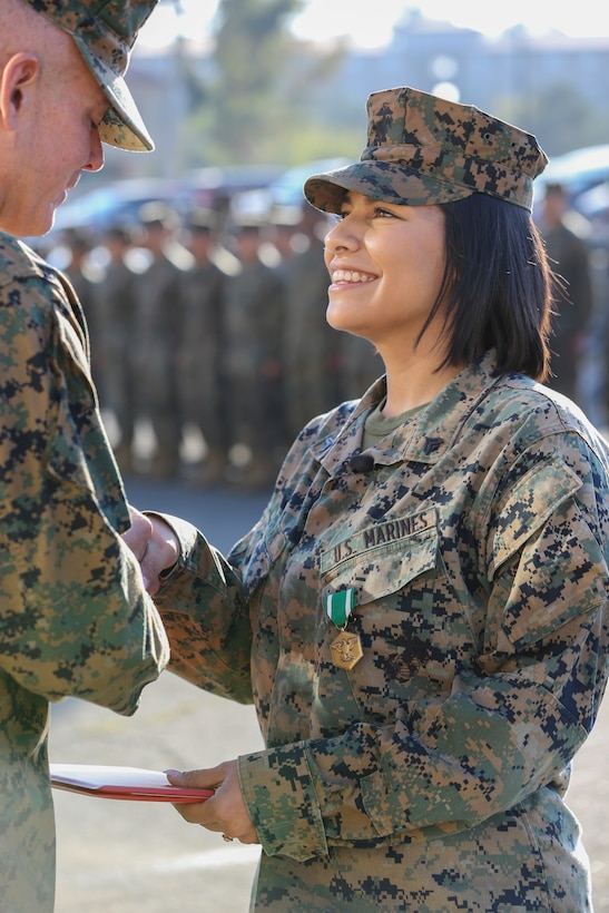 U.S. Marine Cpl. Alexandra Nowak, an administrative specialist with Alpha Company, Headquarters and Support Battalion, Marine Corps Installations West, Marine Corps Base Camp Pendleton, receives a Navy and Marine Corps Commendation Medal from by Brig. Gen. Dan Conley, the commanding general for MCI-West, MCB Camp Pendleton, during an award ceremony on Camp Pendleton, California, Nov. 6, 2019. Nowak received the award for her actions to save a family after a car crash on Interstate Highway 15. Nowak is a native of Forney, Texas.