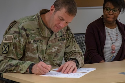Brig. Gen. Charles Lee Knowles signs a charter for the Commander's Ready and Resilient Council program as part of the Alaska National Guard's Soldier care at Joint Base Elmendorf-Richardson, Nov. 6, 2019. The program is designed to align with the state suicide prevention plan of identifying and preventing high-risk behaviors in Soldiers and families.