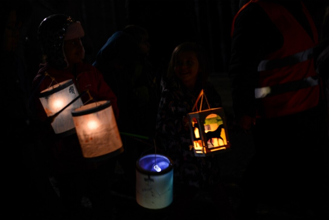 Children from the Kaiserslautern Military Community walk with lanterns in celebration of Martinstag in Landstuhl, Germany, Nov. 7, 2019.