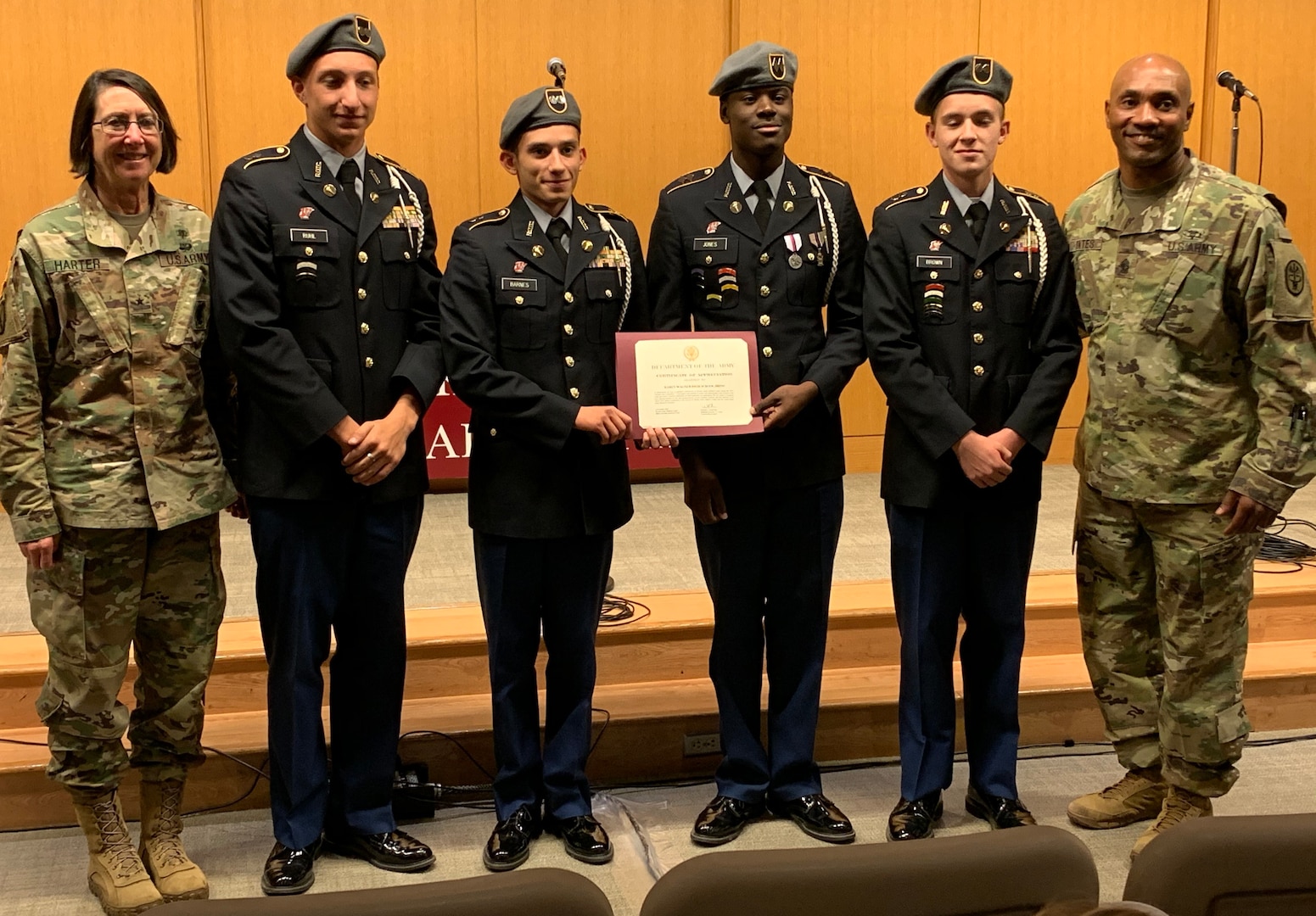 BAMC Commanding General Brig. Gen. Wendy Harter and Command Sgt. Maj. Thomas Oates present a certificate of appreciation to the Wagner High School Junior ROTC Color Guard during the Veterans Day ceremony at Brooke Army Medical Center Nov. 1.