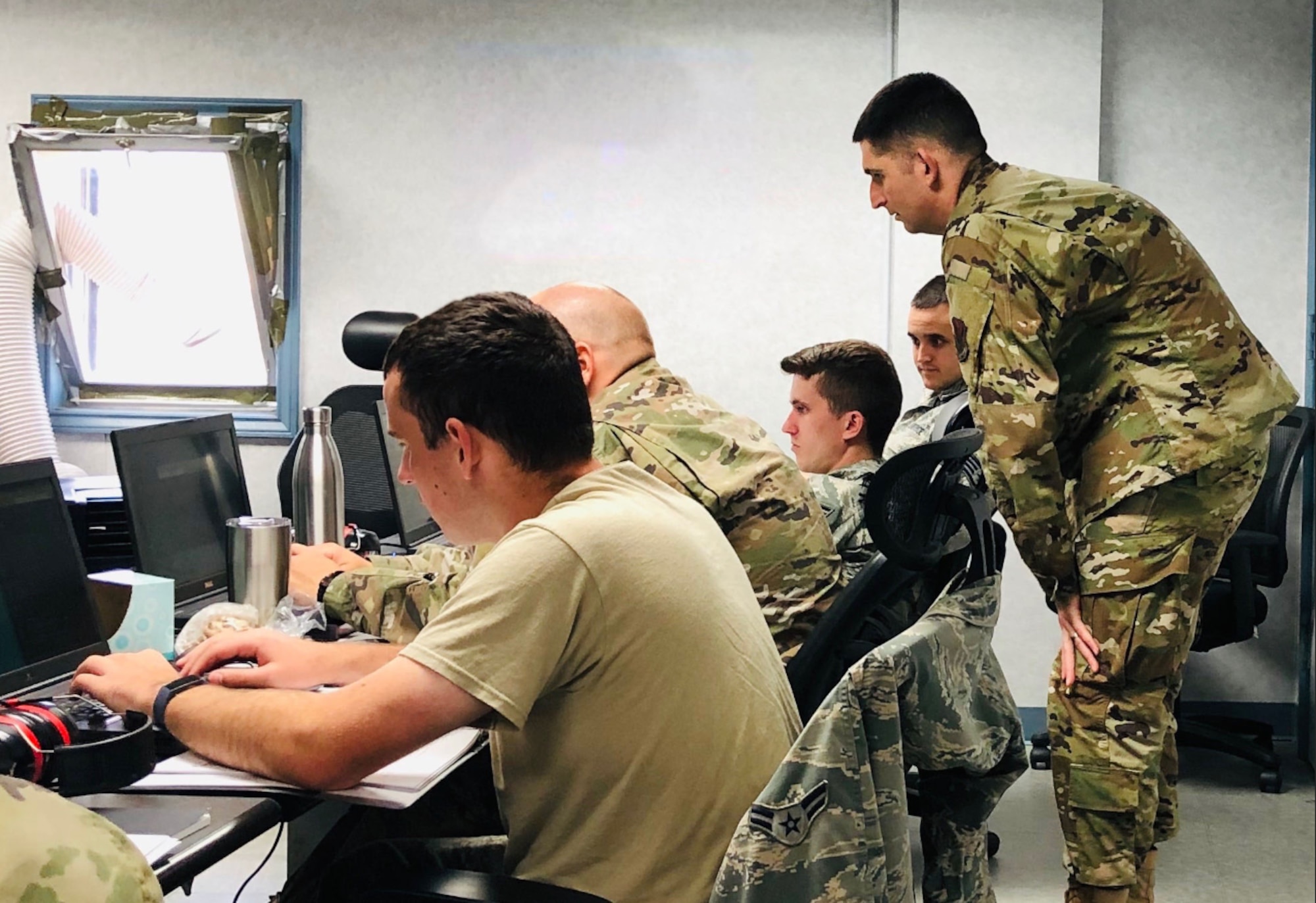 Members of the 552nd Air Control Networks Squadron participate in the Air Force's first mission qualification training course for mission defense teams in Oct. 2019. Nine 552nd ACNS members graduated this course, qualifying them to be operators on the Cyberspace Vulnerability Assessment/Hunter Weapon System.
