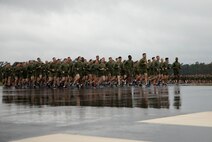 U.S. Marines and Sailors with Marine Corps Air Station New River conduct a station-wide formation run on MCAS New River, Nov. 8, 2019. Marines ran in celebration of the Marine Corps’ 244th birthday.