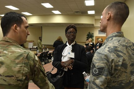 Teresa Middleton, principal of Miracle Academy, talks to Air Force recruiters at Joint Base Charleston Nov. 7, 2019, as part of a continuing effort to strengthen collaboration between leaders from the base and local community.
