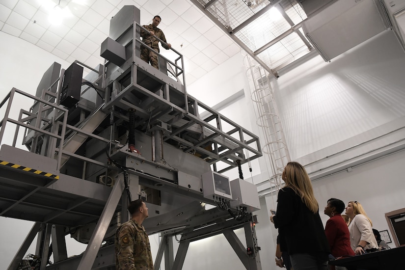 Instructors with the 373rd training detachment show guests a simulation of C-17 Globemaster III landing gear used for training at Joint Base Charleston Nov. 7, 2019, as part of a continuing effort to strengthen collaboration between leaders from the base and local community.
