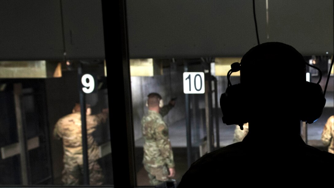 U.S. Air Force Staff Sgt. Brandon Murray, 20th Security Forces combat arms instructor, coaches participants from the combat arms tower in an inaugural M9 pistol Excellence in Competition shooting event at the Combat Arms range complex at Shaw Air Force Base, South Carolina, Nov. 6, 2019.