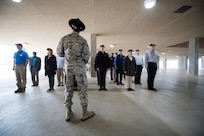 Civic leaders were surprised during the Airmen Training Center tour as U.S. Air Force Tech. Sgt. Lewis Christopher (center), 319th Training Squadron, military training instructor, orders them to get in formation for a crash course on marching, facing movements, and dormitory life, Nov. 7, 2019, at Joint Base San Antonio-Lackland, Texas. During the visit, civic leaders toured missions of 37th Training Wing, 12th Flying Training Wing, 502nd Air Base Wing and Air Force Recruiting Service, all at JBSA locations. The Air Force Civic Leader Program is an Air Staff-level program comprising major command-selected community leaders from a wide variety of industries and sectors, including banking and economic development, construction, manufacturing, education, healthcare, science and technology. The program helps community leaders understand and advocate for the Air Force’s diverse missions.