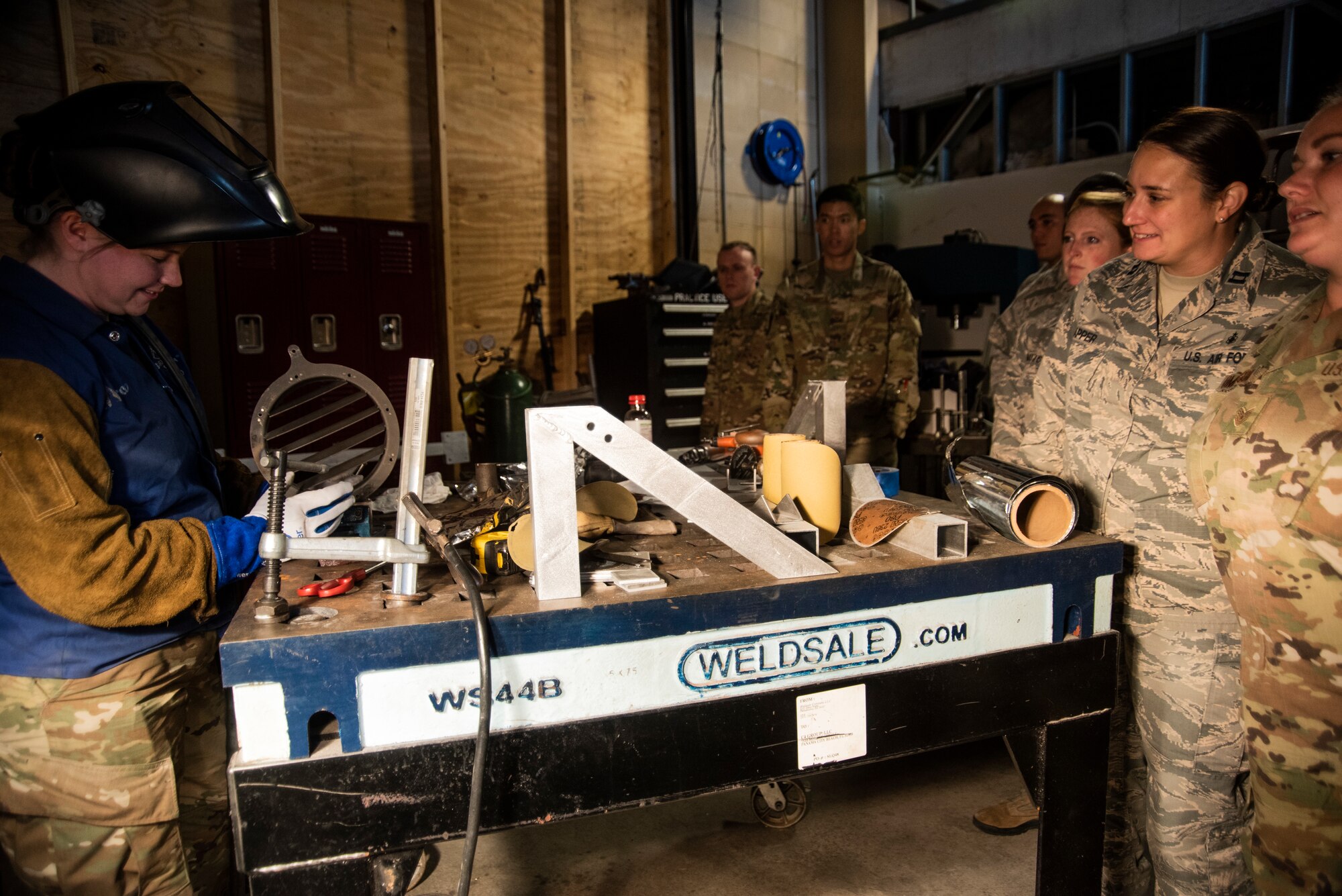 The 53rd Test Support Squadron special devices flight participated in an immersion tour for members assigned to the 325th Fighter Wing on Nov. 8, 2019, at Tyndall Air Force Base, Florida. Airmen visited multiple units of the 53rd Weapons Evaluation Group during the tour, including the metal fabrication shop. The airmen watched as a part was welded by TDY personnel for an aircraft participating in the Weapons System Evaluation Program and Checkered Flag 20-1 exercise on Tyndall's flight line demonstrating the unit's joint partnership with Tyndall, ensuring Airmen are trained and equipment is tested, to support the warfighter. (U.S. Air Force photo by Staff Sgt. Magen M. Reeves)