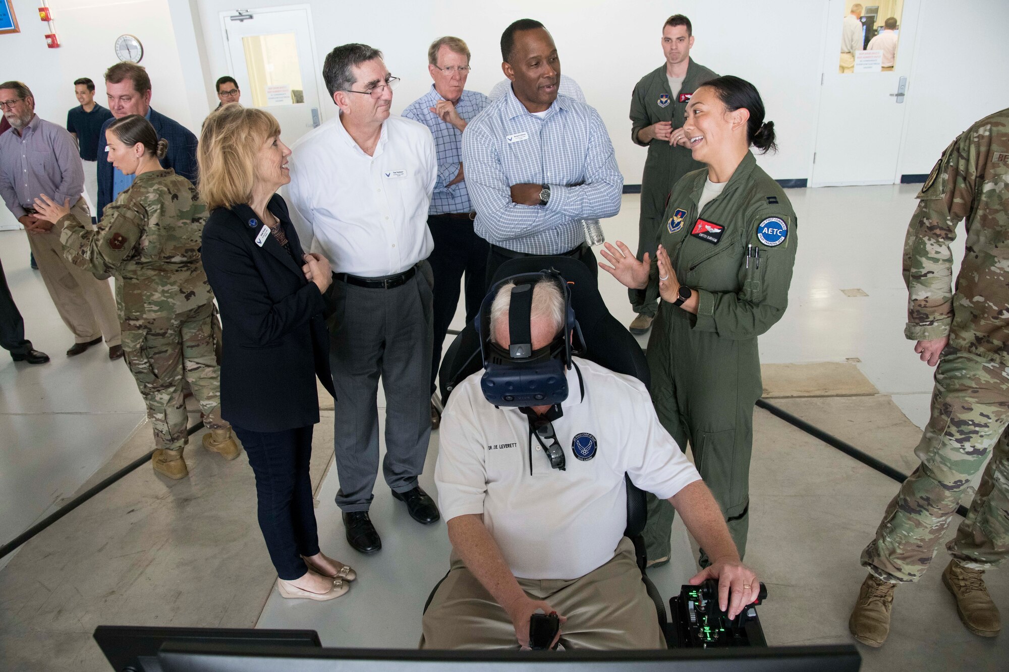 While Dr. Joe Leverett, an Air Education and Training Command civic leader from Altus, Oklahoma, uses the virtual reality system, U.S. Air Force Capt. Christine Durham, Detachment 24 instructor pilot, explains to other civic leaders about how the system is used to train Pilot Training Next students Nov. 6, 2019. During the visit, civic leaders toured missions of the 37th Training Wing, 12th Flying Training Wing, 502nd Air Base Wing and Air Force Recruiting Service, at Joint Base San Antonio. The Air Force Civic Leader Tour Program helps community leaders understand and advocate for the Air Force’s diverse missions.
