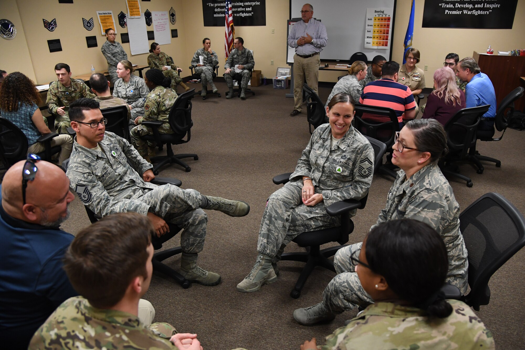 Keesler personnel participate in a "Star Power" exercise during the Leadership Enhancement and Development Seminar inside the Airman Leadership School building at Keesler Air Force Base, Mississippi, Nov. 5, 2019. The three-day course, which is open to all supervisors, is meant to enhance effective communication, skillful interpersonal interaction and emotional intelligence in the military environment by using an active learning format that emphasizes discussion and minimizes lecture. (U.S. Air Force photo by Kemberly Groue)