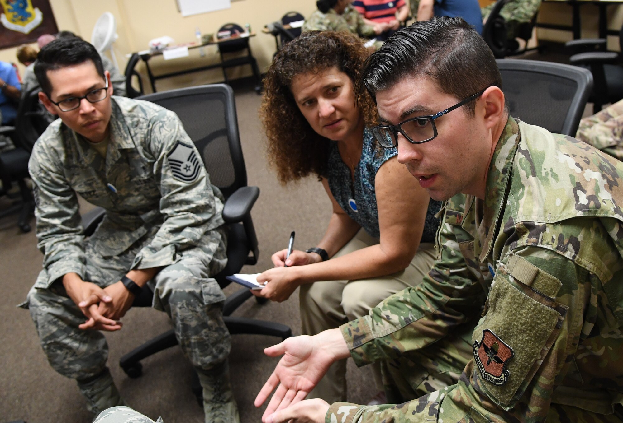 U.S. Air Force Tech. Sgt. Zach McDaniel, 81st Medical Operations Squadron respiratory therapy NCO in charge, participates in a discussion with fellow students during a "Star Power" exercise during the Leadership Enhancement and Development Seminar inside the Airman Leadership School building at Keesler Air Force Base, Mississippi, Nov. 5, 2019. The three-day course, which is open to all supervisors, is meant to enhance effective communication, skillful interpersonal interaction and emotional intelligence in the military environment by using an active learning format that emphasizes discussion and minimizes lecture. (U.S. Air Force photo by Kemberly Groue)