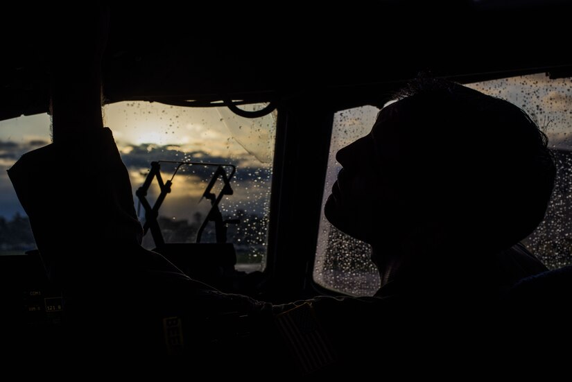 U.S. Air Force Capt. Shawn McDonald, 6th Airlift Squadron pilot, checks controls in the cockpit of a C-17 Globemaster III on Joint Base McGuire-Dix-Lakehurst, New Jersey, Nov. 5, 2019. McDonald was preparing the aircraft before takeoff to Fort Sill, Oklahoma, for a joint training exercise with the 3rd Battalion, 2nd Air Defense Artillery Regiment. (U.S. Air Force photo by Airman 1st Class Ariel Owings)