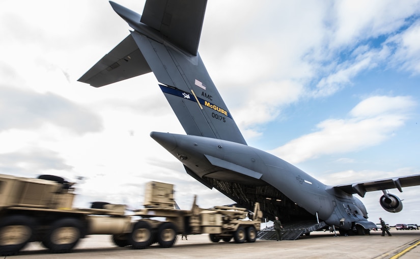 A Fort Sill, Oklahoma M902 Patriot Missile Launcher pulled by a HEMTT M983A4 Light Equipment Transporter is unloaded from a Joint Base McGuire-Dix-Lakehurst, New Jersey C-17 Globemaster III on Fort Sill, Nov. 5, 2019. After months of planning, the teams successfully loaded and airlifted the Fort Sill equipment as part of a joint training exercise to teach sister services to work and communicate together in preparation to defeat potential threats across the spectrum of operations. (U.S. Air Force photo by Airman 1st Class Ariel Owings)