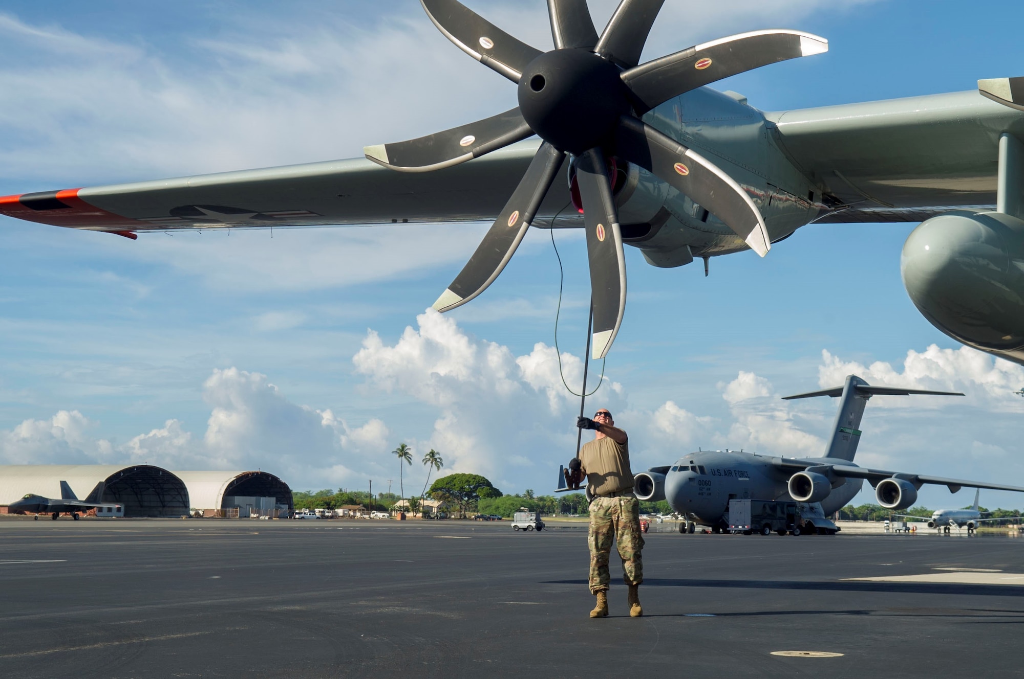 An Airman assigned to the 109th Airlift Wing, Stratton Air National Guard Base, New York, performs pre-flight inspections on the flightline at Joint Base Pearl Harbor-Hickam, Hawaii, Oct. 31, 2019. All the LC-130 aircraft need to be in theater in a timely fashion to support the National Science Foundation’s mission. Pacific Air Forces operates on a 24-hour basis to provide complete joint operational and logistic support for the National Science Foundation-managed U.S. Antarctic Program (USAP). Operation DEEP FREEZE is the U.S. military’s contribution to the civilian-managed USAP. (U.S. Air Force photo by Staff Sgt. Mikaley Kline)
