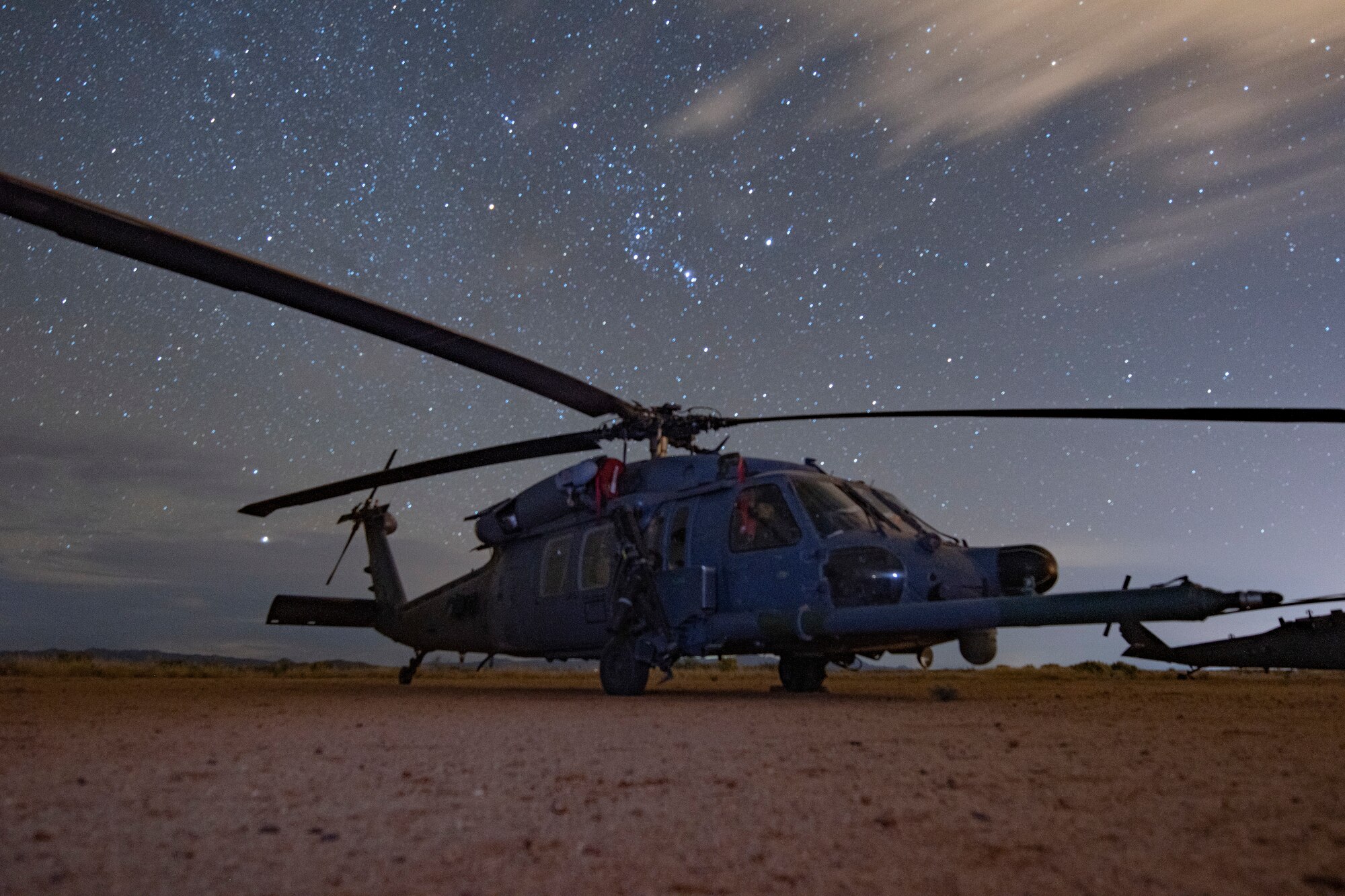 A U.S. Air Force HH-60G Pave Hawk from the 66th Rescue Squadron cloaks under the cover of darkness while exercising the Dynamic Wing concept