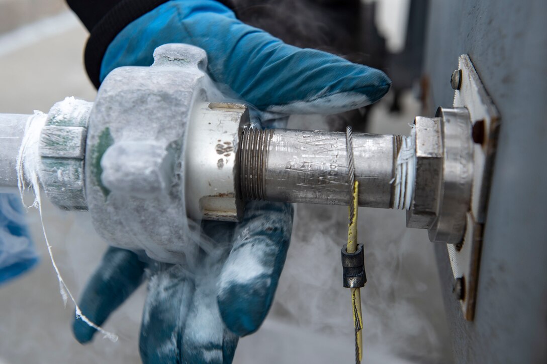 Senior Airman Gavin Rees, 23d Logistics Readiness Squadron (LRS) fuels facilities technician, connects a servicing hose to a tank of liquid oxygen (LOX) Oct. 30, 2019, at Moody Air Force Base, Ga. LOX is used as a continuous supply of breathable air to pilots and aircrew at high altitudes. The 23d LRS fuels facilities Airmen fill tanks, take samples of LOX and conduct odor tests to evaluate its purity. (U.S. Air Force photo by Airman Azaria E. Foster)