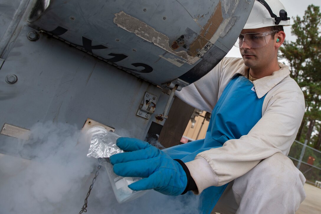 Senior Airman Gavin Rees, 23d Logistics Readiness Squadron (LRS) fuels facilities technician, collects a sample of liquid oxygen (LOX) Oct. 30, 2019, at Moody Air Force Base, Ga. LOX is used as a continuous supply of breathable air to pilots and aircrew at high altitudes. The 23d LRS fuels facilities Airmen fill tanks, take samples of LOX and conduct odor tests to evaluate its purity. (U.S. Air Force photo by Airman Azaria E. Foster)