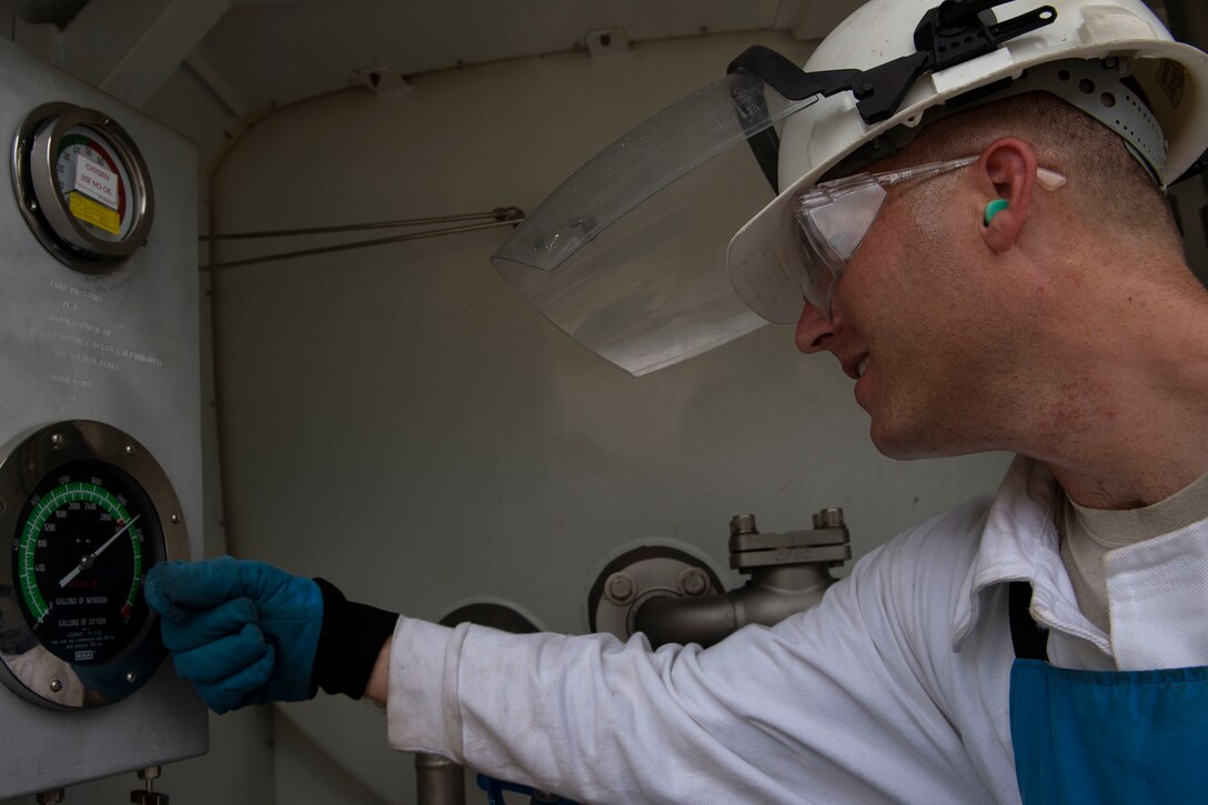 Staff Sgt. Bryan White, 23d Logistics Readiness Squadron (LRS) fuels facilities NCO in charge, checks the gauge on a liquid oxygen (LOX) tank Oct. 30, 2019, at Moody Air Force Base, Ga. LOX is used as a continuous supply of breathable air to pilots and aircrew at high altitudes. The 23d LRS fuels facilities Airmen fill tanks, take samples of LOX and conduct odor tests to evaluate its purity. (U.S. Air Force photo by Airman Azaria E. Foster)