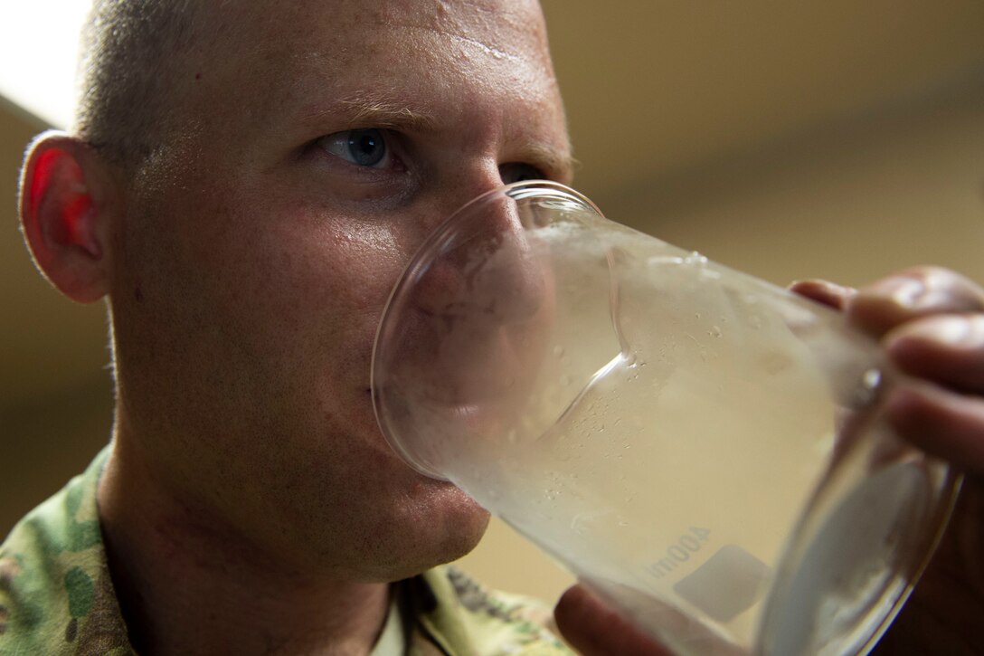 Staff Sgt. Bryan White, 23d Logistics Readiness Squadron (LRS) fuels facilities NCO in charge, performs an odor test on a sample of room temperature liquid oxygen (LOX) Oct. 30, 2019, at Moody Air Force Base, Ga. LOX is used as a continuous supply of breathable air to pilots and aircrew at high altitudes. The 23d LRS fuels facilities Airmen fill tanks, take samples of LOX and conduct odor tests to evaluate its purity. (U.S. Air Force photo by Airman Azaria E. Foster)
