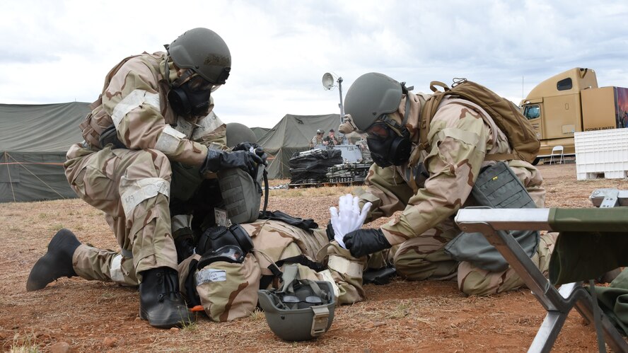 A U.S. Air Force Airman receive medical care for a simulated nerve agent attack on the central operating base