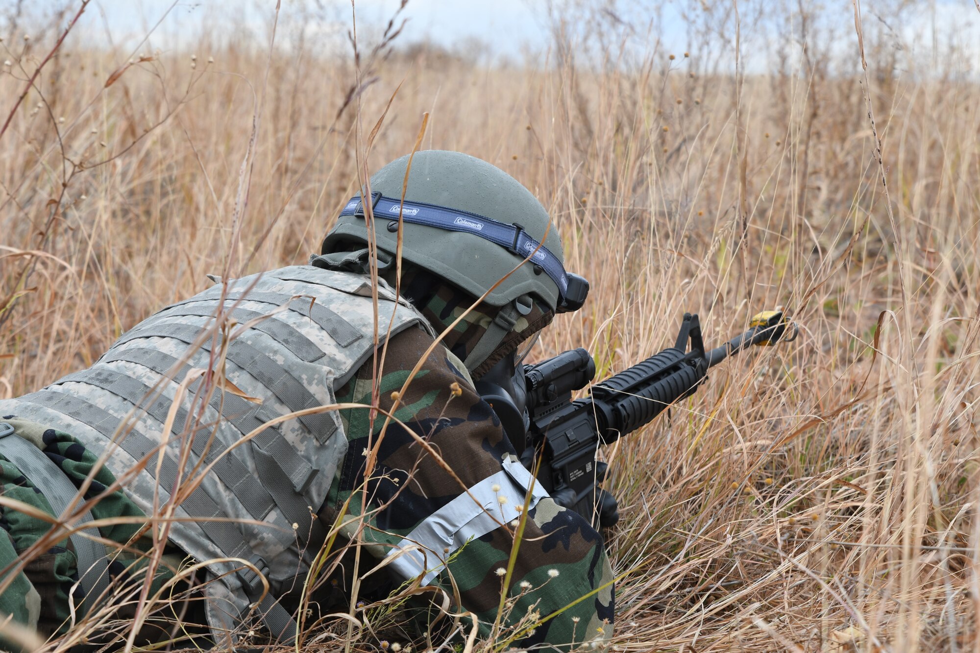 a photo of an airman defending the base during a simulated attack